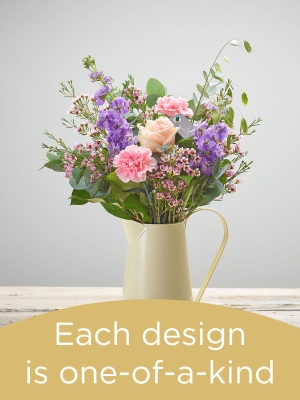 Hand tied bouquet and vase made with seasonal flowers