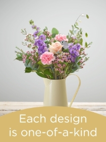 Hand tied bouquet and vase made with seasonal flowers